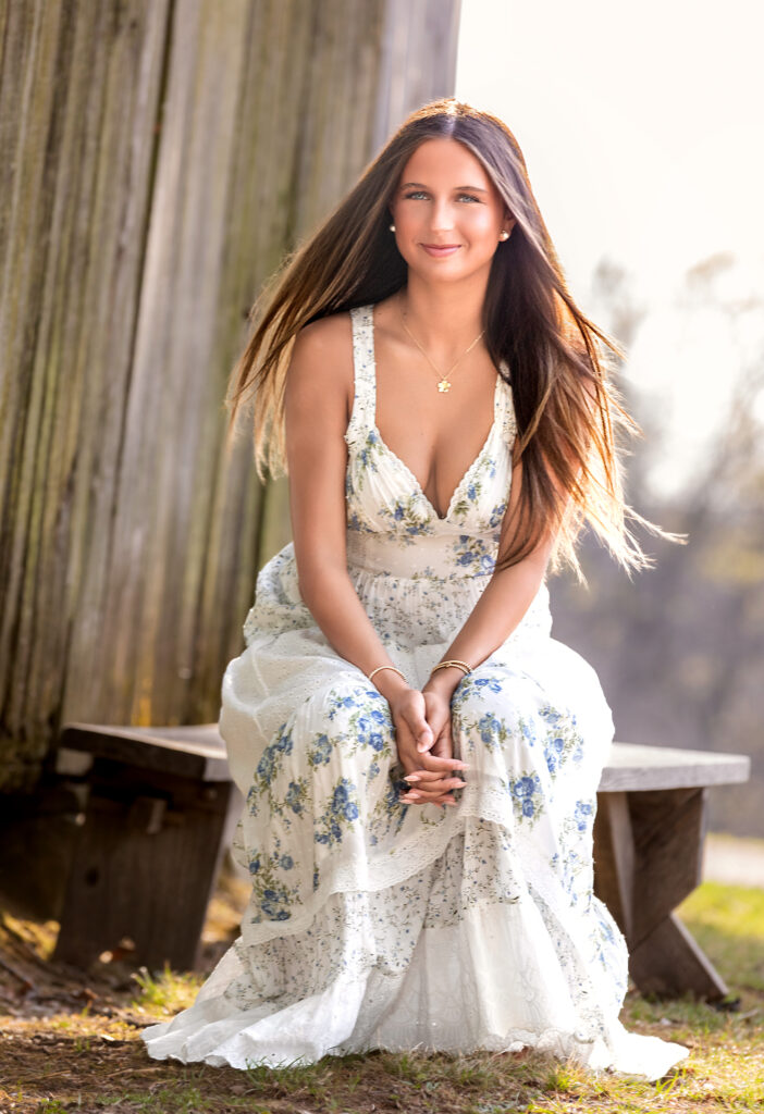high school senior sitting on a bench