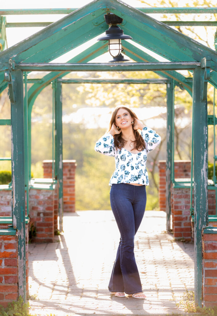 senior portrait standing in a doorway