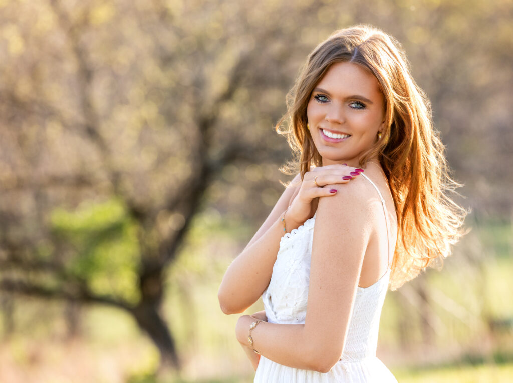 senior portrait with a girl in fields