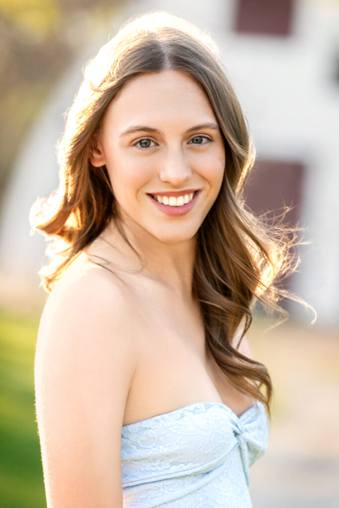 High school senior Spring season brown hair fair complexion close up back lit