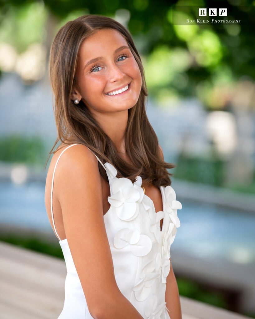 High school senior close up in a long white dress