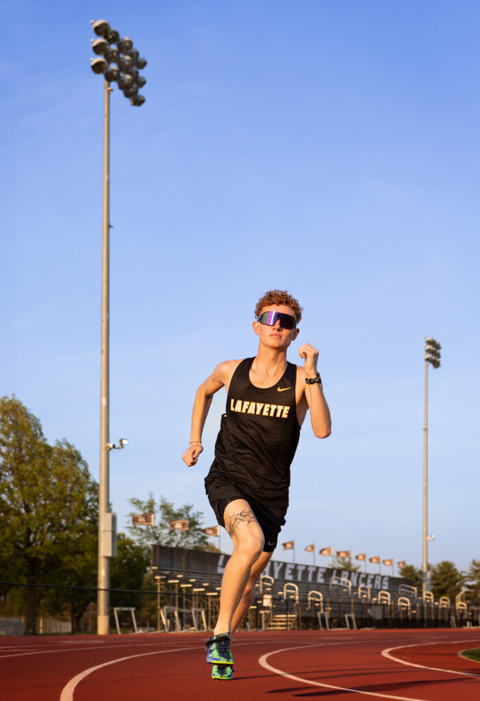 High school senior running on the track at Lafayette High School